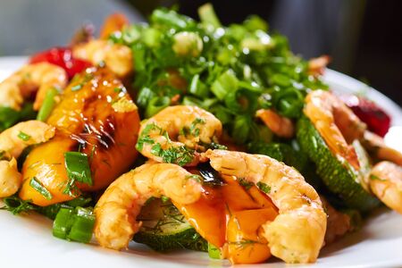 hot appetizer with vegetables and prawnsの写真素材