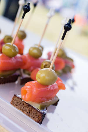 appetizer on skewers with red fishの写真素材