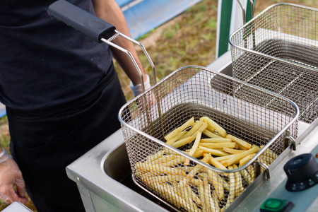 cooking french friesの写真素材
