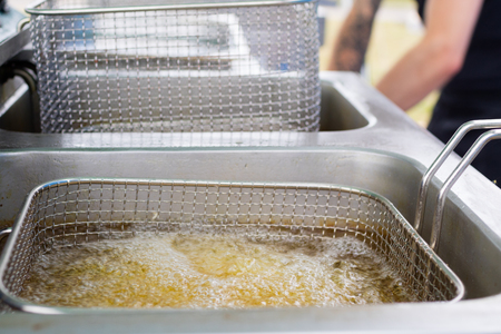 cooking french friesの写真素材