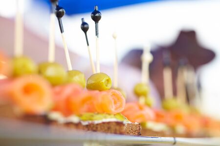 appetizer on skewers with red fish