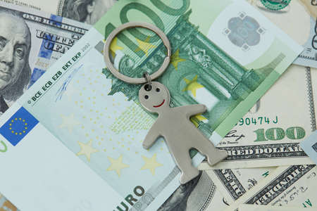 notes of dollars and euro and little manの写真素材