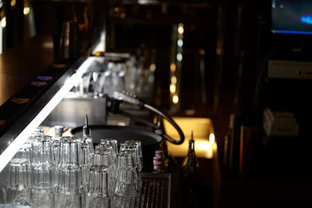 clean glasses behind the barの写真素材