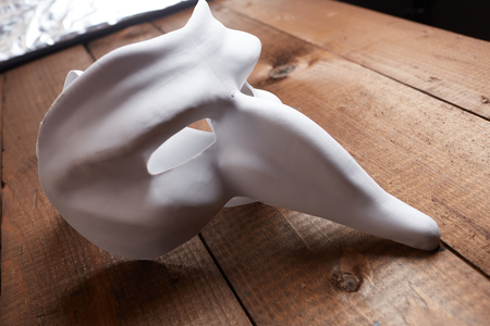 White Venetian mask on the tableの写真素材