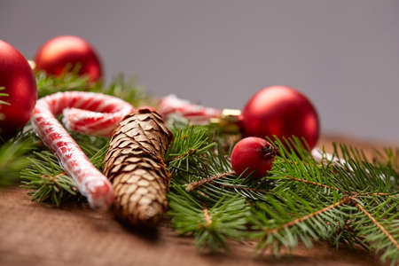 Christmas tree branch, candy, cones, balls