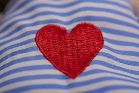 embroidery in the form of heartの写真素材