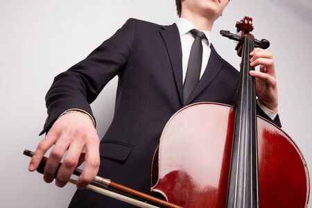 young man with a celloの写真素材