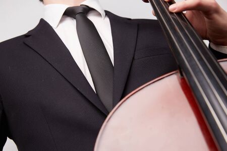 young man with a celloの写真素材