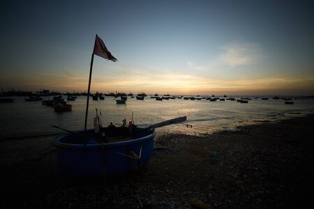 fishing boats on the shore in Vietnamの写真素材