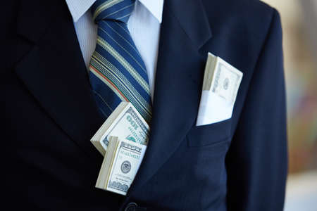 money in the pocket of a businessman