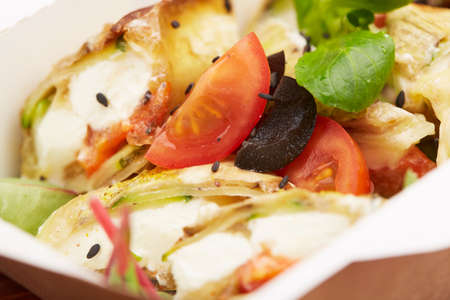 meal with fish, cherry tomatoes and herbsの写真素材