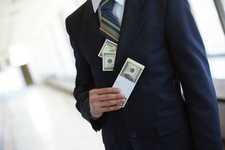money in the pocket of a businessman