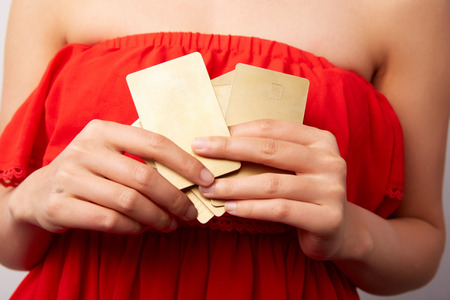 Chinese girl with gold cardsの写真素材