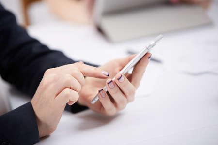 mobile phone in the women's handsの写真素材