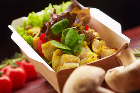 delicious breakfast with fish, cherry tomatoes and herbsの写真素材