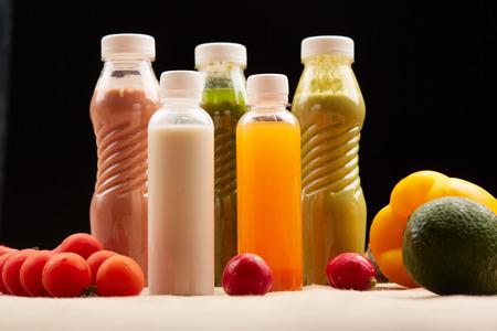 bottles of juices and vegetable smoothies healthy foodの写真素材