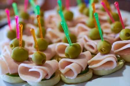 tasty appetizers on skewers at the buffetの写真素材