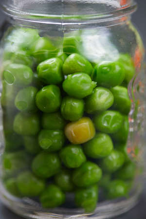 Green peas in a jarの写真素材