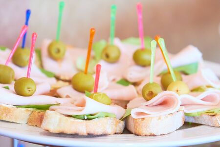 tasty appetizers on skewers at the buffetの写真素材