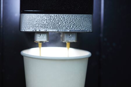 Coffee is poured into the machine, strong steamの写真素材