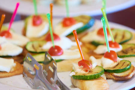 tasty appetizers on skewers at the buffetの写真素材