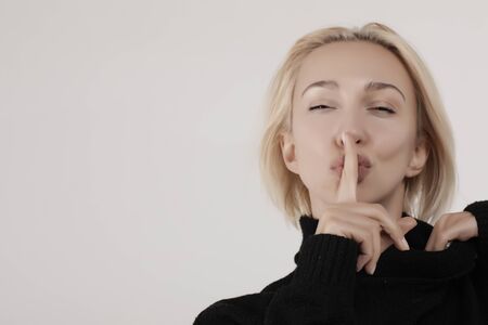 blonde in a black sweater quieter