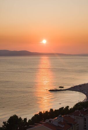 Beach on the sea at sunsetの写真素材