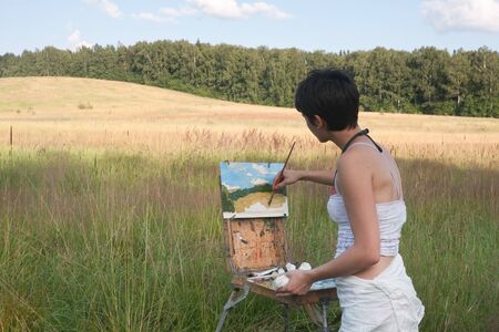 Painter-girl en plein airの写真素材
