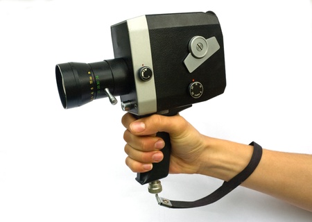 Woman holding Old-Fashioned Retro Camera. Isolated on Whiteの写真素材