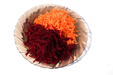 Platel of freshly cut vegetables isolated on a white backgroundの写真素材