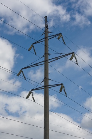 Power transmission tower carrying electricity from different parts of countryの写真素材