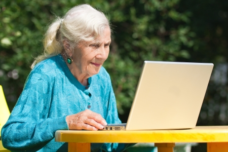 The grandmother with notebookの写真素材
