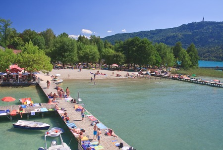Beach on Lake Worth. Resort Portschach am Worthersee. Austriaのeditorial素材