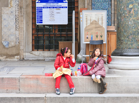 Children in the courtyard of the New Mosque (Yeni Cami) Istanbulのeditorial素材