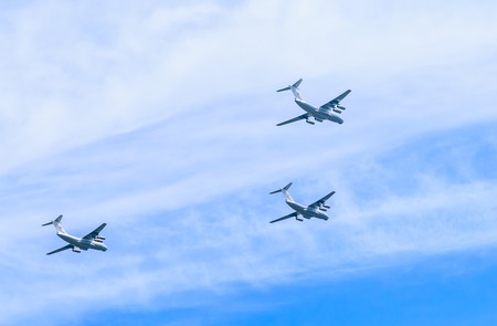 MOSCOW/RUSSIA - MAY 9: 3 Ilyushin Il-76 (Candid) multi-purpose four-engined strategic airlifters fly...