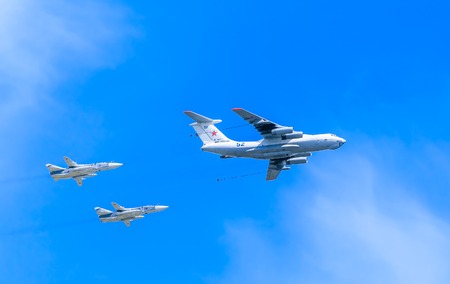 MOSCOW/RUSSIA - MAY 9: Il-78 (Midas) aerial tanker demonstrates refueling of 2 Su-24 (Fencer) supersonic attack aircrafts on parade devoted to 70-th Victory Day aniversary on May 9, 2015 in Moscow.のeditorial素材
