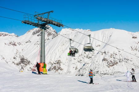 LIVIGNO, ITALY - JANUARY 26, 2015: Gondola cable car and ski slopes in the mountains of winter resort Livigno, Lombardi, January 26, 2015, Italy. Livigno is developing ski resort in northern Italyのeditorial素材
