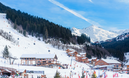 Meribel Ski Resort, Meribel Village Center (1450 m). Lower gondola station Tougnete1 and Rhodos. Franceのeditorial素材