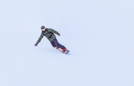 Snowboarder on the slopes of the ski resortのeditorial素材