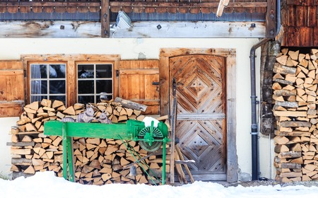 Country house with a supply of firewood for the winter mountains. Ski resort Laax. Switzerlandの写真素材