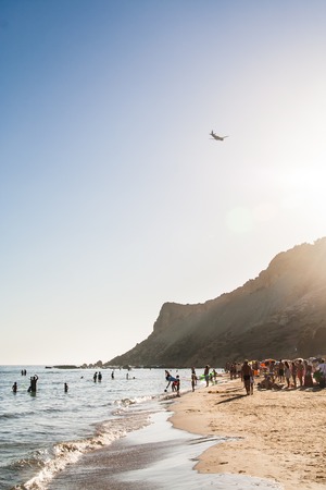 Unidentified people on the beach near white cliff called "Scala dei Turchi" in Sicily, near Agrigento. Italyの写真素材