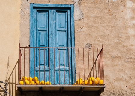 Balcony with yellow melons. Sicily. Italyの写真素材