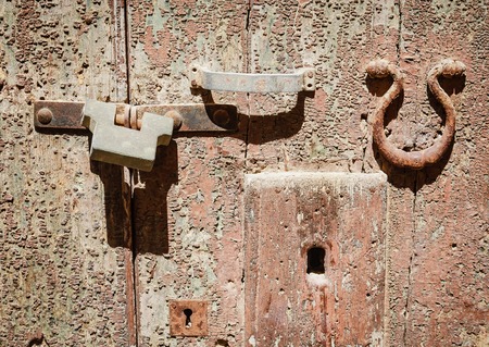 Detail of an old door with handle and lockの写真素材