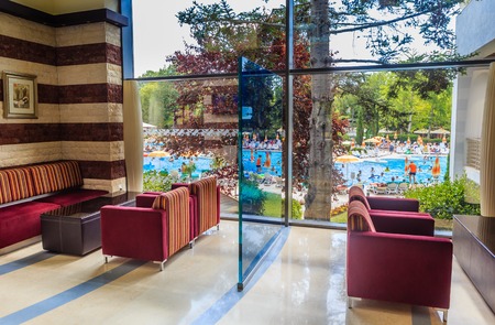 The interior of the hall of the hotel overlooking the pool.  Hotel Flamingo Grand Hotel. Albena, Bulgariaのeditorial素材