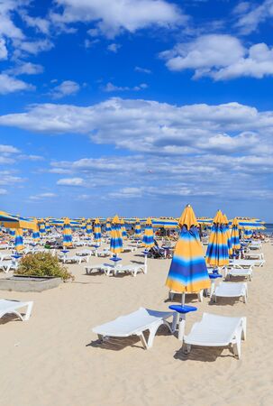 The Black Sea shore, blue clear water, beach with sand, umbrellas and sunbeds. Albena, Bulgariaのeditorial素材