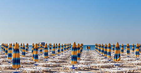 The Black Sea shore, blue clear water, beach with sand, umbrellas and sunbeds. Morning. Resort Albena, Bulgariaのeditorial素材