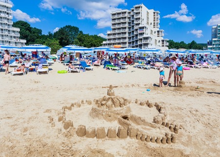 The Black Sea shore, blue clear water, beach with sand, umbrellas and sunbeds. Albena, Bulgariaのeditorial素材