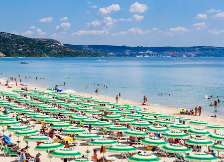 The Black Sea shore, blue clear water, beach with sand, umbrellas and sunbeds. Albena, Bulgariaのeditorial素材