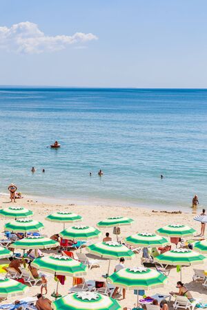 The Black Sea shore, blue clear water, beach with sand, umbrellas and sunbeds. Albena, Bulgariaのeditorial素材