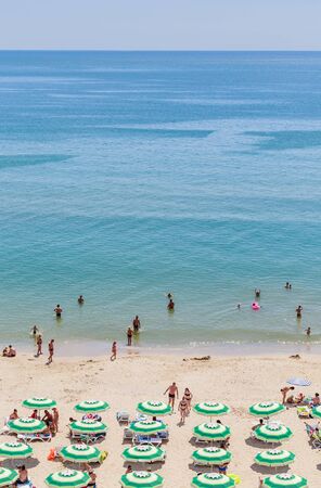 The Black Sea shore, blue clear water, beach with sand, umbrellas and sunbeds. Albena, Bulgariaの写真素材